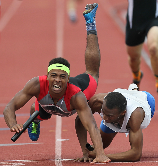 Second Place, Sports Action - Jeremy Wadsworth / The (Toledo) BladeColumbus Eastmoor Academy's Jalon Lewis, left, collides with Dayton Dunbar's JaVonta Brown at the end of the Division II 4x400 meter relay during the State Track and Field Meet at Jesse Owens Memorial Stadium in Columbus. 