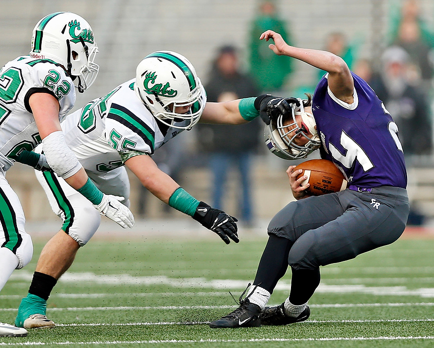 Award of Excellence, Sports Action - Barbara J. Perenic / The Columbus DispatchWill Homan (24) of Fort Recovery is nabbed by Paul Skye (55) of Mogadore during the Division VII state championship game at Ohio Stadium in Columbus.