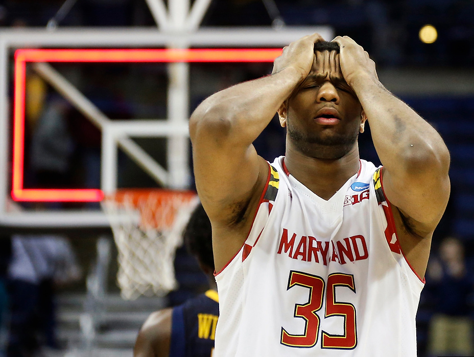 First Place, Ron Kuntz Sports Photographer of the Year - Barbara J. Perenic / The Columbus DispatchDamonte Dodd (35) of the Maryland Terrapins reacts as the buzzer sounds to a 69-59 loss to the West Virginia Mountaineers in Sunday's third-round NCAA basketball tournament game at Nationwide Arena in Columbus on March 22, 2015. 