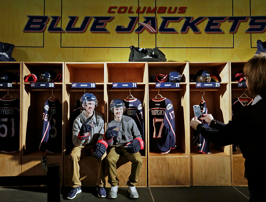 First Place, Ron Kuntz Sports Photographer of the Year - Barbara J. Perenic / The Columbus DispatchYoung hockey fans suit up for a photo inside a replica of the Columbus Blue Jackets' locker room during NHL All-Star Weekend at Nationwide Arena in Columbus on Sunday, January 25, 2015. 
