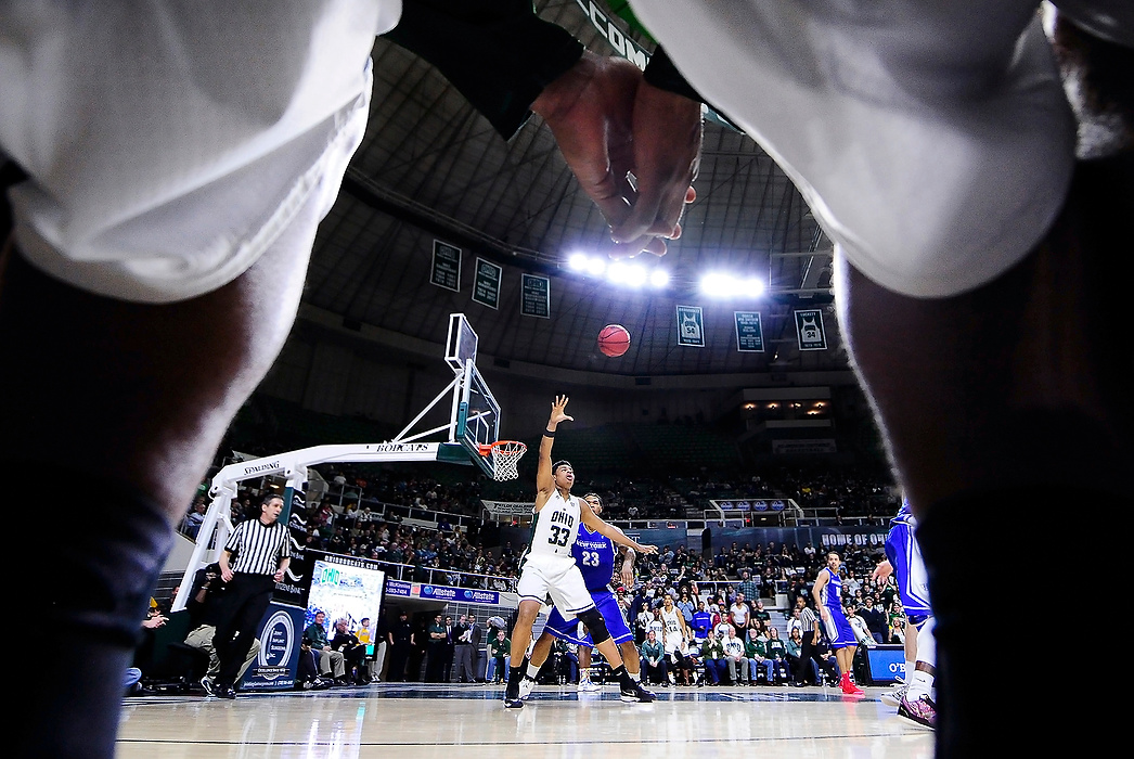 Second Place, Ron Kuntz Sports Photographer of the Year - Logan Riely / Ohio UniversityOhio University center Anthony Campbell reaches for a high pass down under the basket during their game against the University of Buffalo on Jan. 24, 2015 in the Convocation Center in Athens, Ohio. The Bobcats would end up winning 63-61.