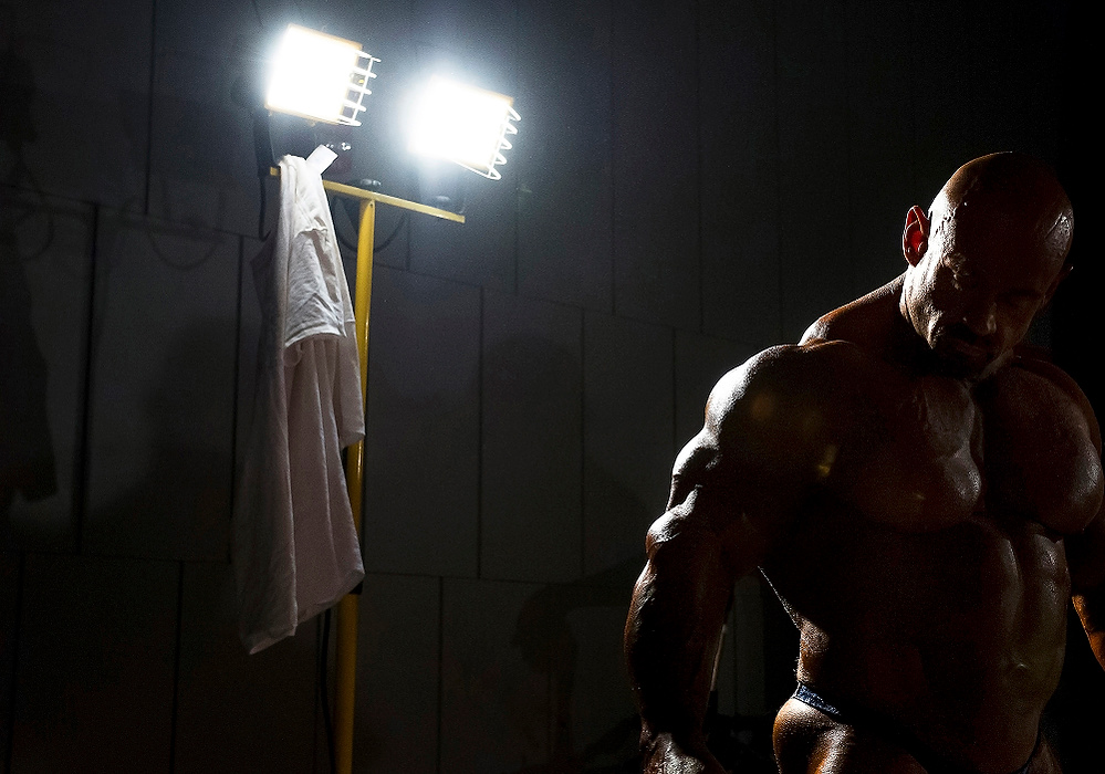 Second Place, Ron Kuntz Sports Photographer of the Year - Logan Riely / Ohio UniversityIFBB professional bodybuilder Branch Warren prepares his mind in the backstage waiting room prior to going on stage for the 26th annual Arnold Classic event held in the Ohio Convention Centers Battelle stage  on March 7, 2015, in Columbus, Ohio.