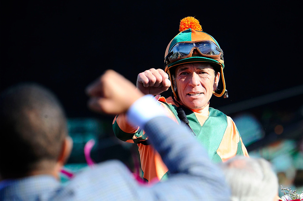 Second Place, Ron Kuntz Sports Photographer of the Year - Logan Riely / Ohio UniversityJockey Kerwin D. Clark thanks a man in the crowd atop of his horse Lovely Maria #7 while in the Victory Circle after winning the 141st running of the Kentucky Oaks on May 1, 2015, at Churchill Downs racetrack. 