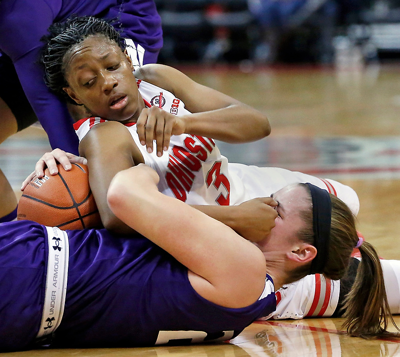 First Place, Ron Kuntz Sports Photographer of the Year - Barbara J. Perenic / The Columbus DispatchNorthwestern Wildcats guard Maggie Lyon (25)  was accidentally hit in the face by Ohio State Buckeyes guard Kelsey Mitchell (3) while the two struggled over a loose ball during Sunday's NCAA Division I women's basketball game at Value City Arena in Columbus on January 4, 2015. 
