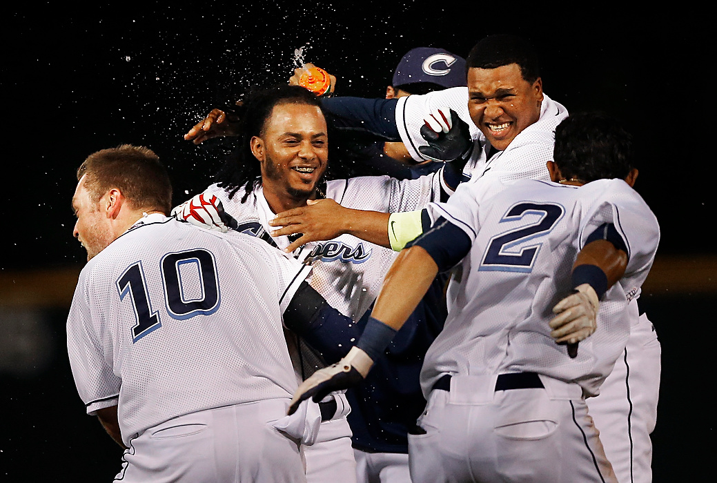, Student Photographer of the Year - Eli C. Hiller / Ohio UniversityColumbus Clippers team members douse shortstop Michael Martinez, center, after he hit a double that won them the game 9-8 against the Indianapolis Indians in the 12th inning at Huntington Park in Columbus, Ohio on July 27, 2015.