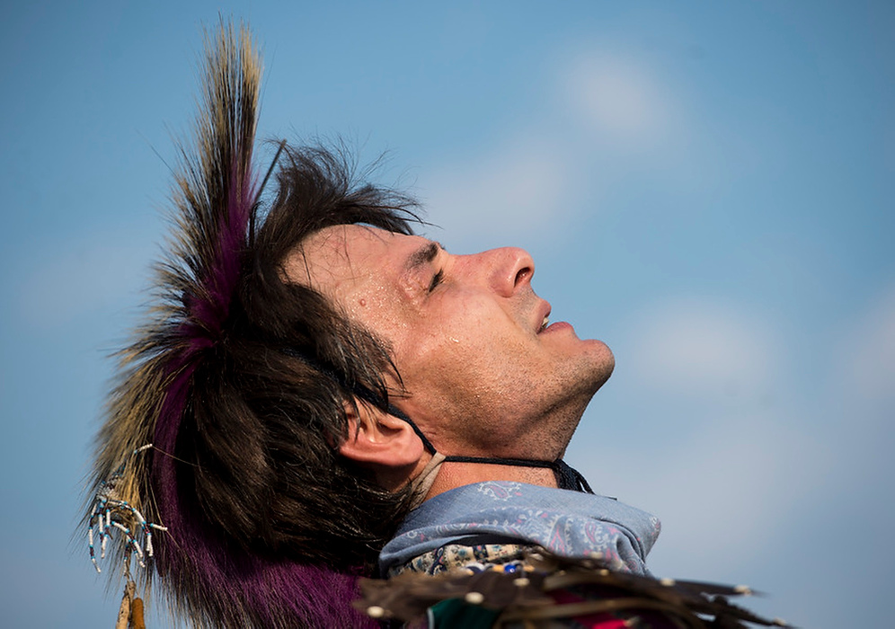 , Student Photographer of the Year - Eli C. Hiller / Ohio UniversityStuart Engler Jr. throws up his head in exhaust as he finishes the last dance of the day during a Lenape powwow in Jefferson, Ohio on August 29, 2015. Engler has been dancing in powwows since he was ten. "For me dancing is a spiritual participation that unites Native Americans with the elements of the world around them," sand Engler. 