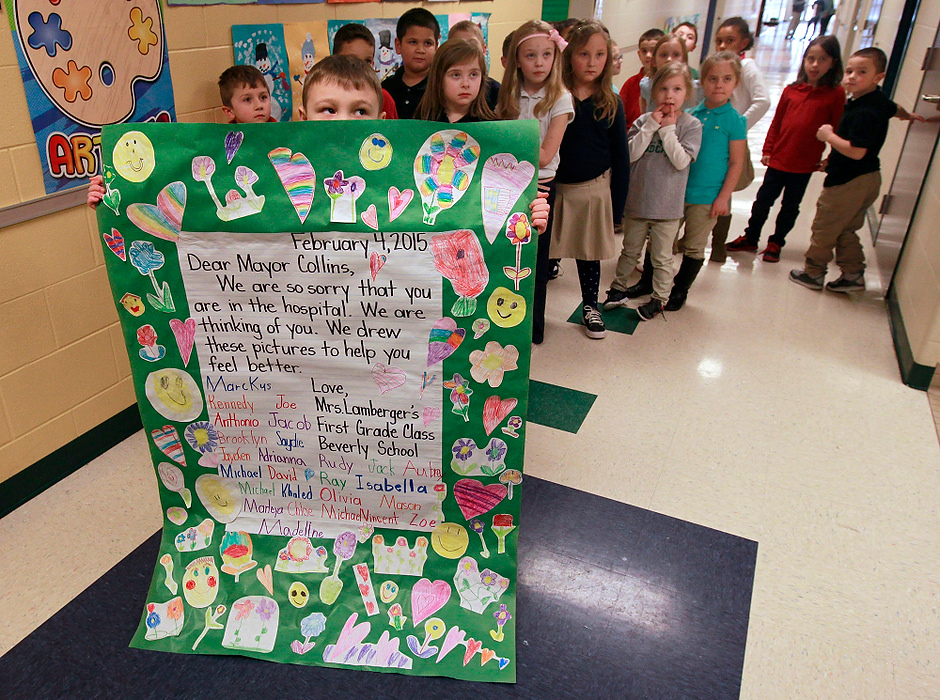 First Place, Team Picture Story - Lori King / The (Toledo) BladeOn February 1, 2015, Toledo Mayor D. Michael Collins suffered cardiac arrest while driving during in a snowstorm.  He remained in a hospital in critical condition until he died on February 6.  Students at a Toledo elementary school created a get well card for the mayor.