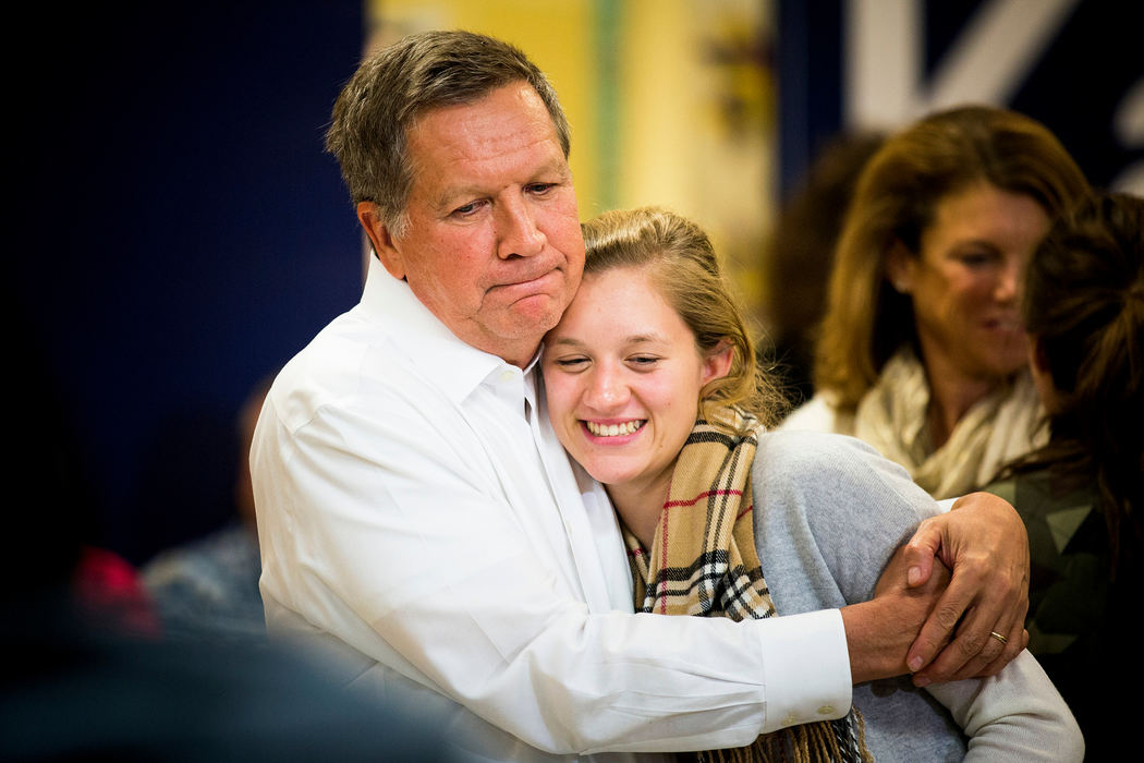 Award of Excellence, Feature Picture Story - Meg Vogel / Cincinnati EnquirerGov. John Kasich hugs his daughter, Emma, after a town hall at Lebanon Senior Center in Lebanon, N.H. Hampshire Monday, January 18, 2016.  Kasich's twin daughters, Emma and Reese, joined their dad on the trail for their 16th birthdays. 