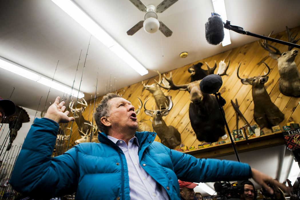 Award of Excellence, Feature Picture Story - Meg Vogel / Cincinnati EnquirerGov. Kasich tells a story about seeing a bear in the wild, while visiting the Walt Morse Sporting Good Store in Hillsboro, N.H. Tuesday, January 19, 2016.