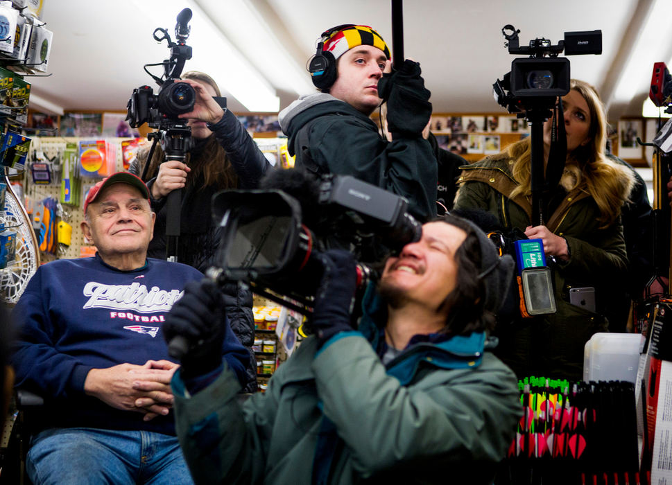 Award of Excellence, Feature Picture Story - Meg Vogel / Cincinnati EnquirerA man listens to Gov. John Kasich talk to the owner of Walt Morse Sporting Good Store, during a visit in Hillsboro, N.H. Tuesday, January 19, 2016. As Gov. Kasich did better in the polls, more national media outlets began to follow him, including documentary crews from Showtime and Huffington Post.