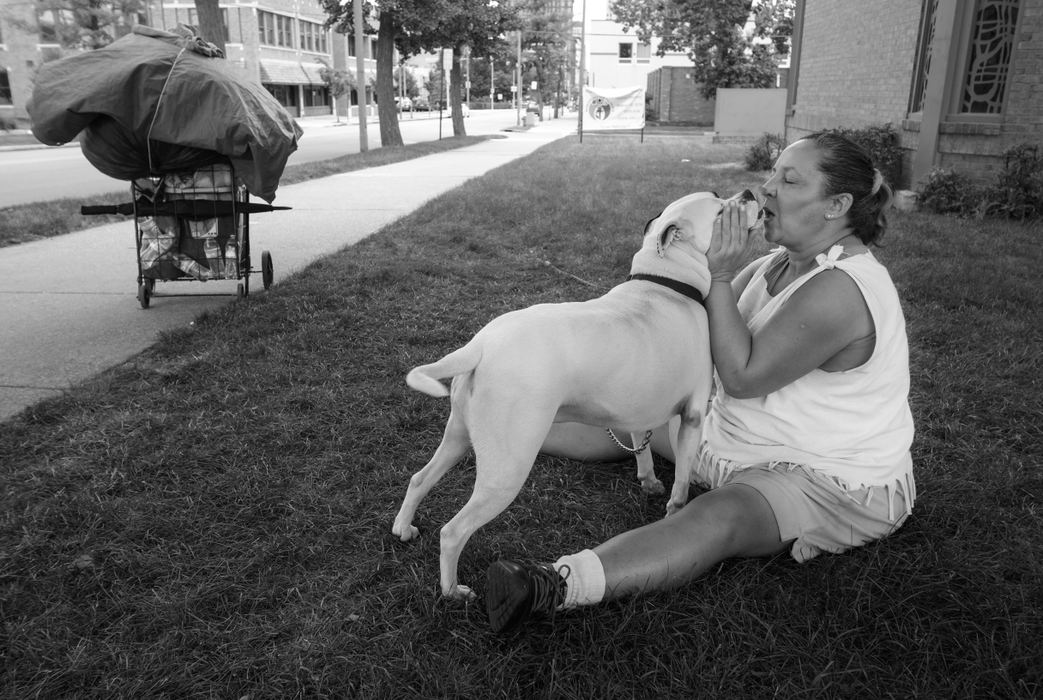First Place, Feature Picture Story - Andy Morrison / The (Toledo) BladeDiann Wears talks to her dog Cow as they rest near a church that is friendly to homeless people. 