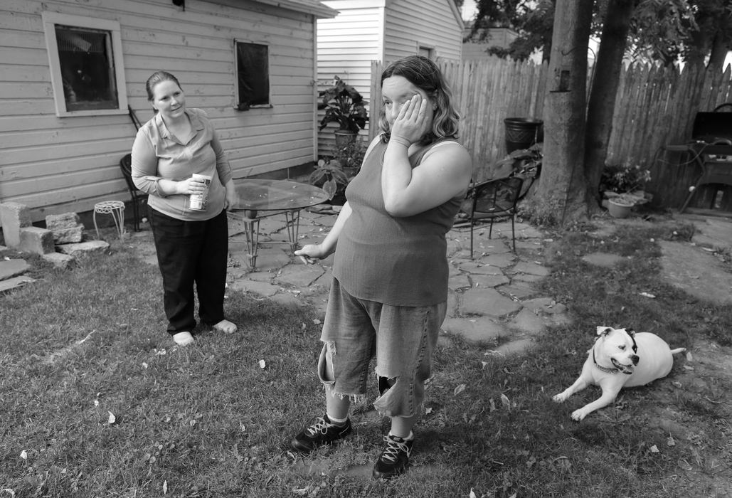 First Place, Feature Picture Story - Andy Morrison / The (Toledo) BladeAn emotional Diann Wears pauses for a moment as she and her dog Cow meet their new landlord Theresa Kim who offered her a low-rent apartment after hearing about her story from a friend.