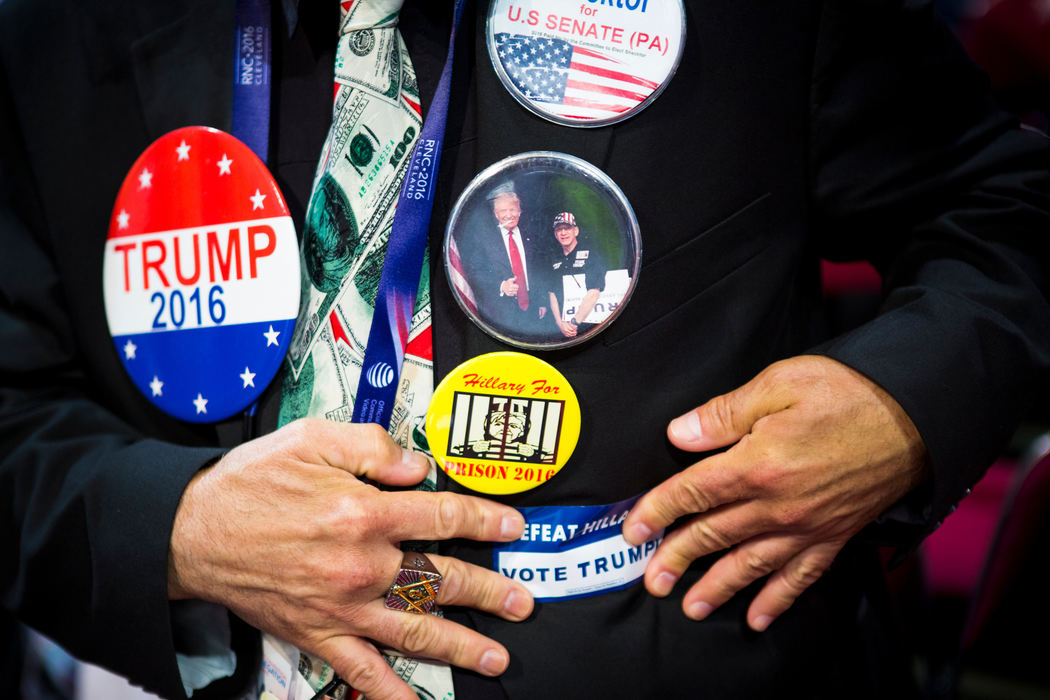Award of Excellence, News Picture Story - Meg Vogel / Cincinnati EnquirerAndrew Shecktor, of Pennsylvania, adds a sticker to his blazer on the final night of the Republican National Convention at Quicken Loans Arena in Cleveland, Ohio Thursday, July 21, 2016. 