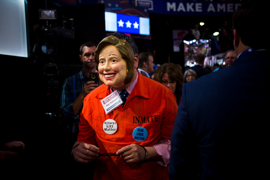 Award of Excellence, News Picture Story - Meg Vogel / Cincinnati EnquirerWes Nakagiri, a delegate from Michigan, walks through the delegates with a Hillary Clinton mask on for the final night of the Republican National Convention at Quicken Loans Arena in Cleveland, Ohio Thursday, July 21, 2016. 