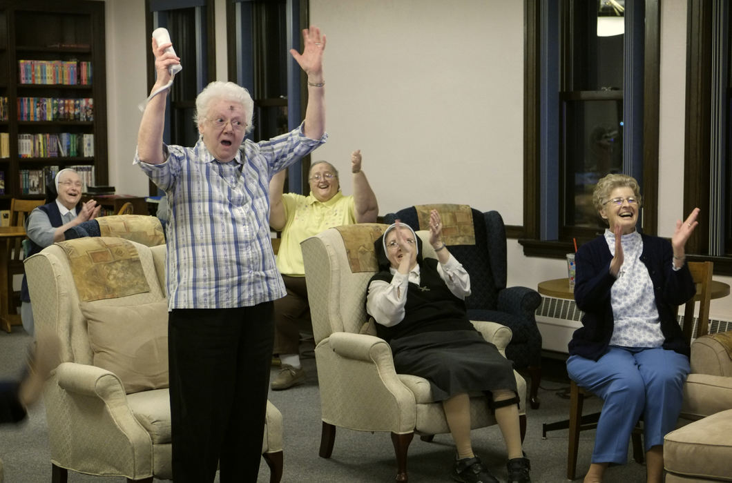 Third Place, Ohio Understanding Award - Andy Morrison / The (Toledo) BladeSr. Arlene Marie Hoffman reacts during a weekly game of Wii bowling with other Sisters of Notre Dame.