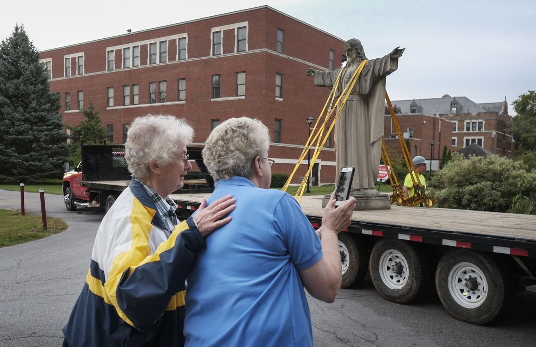 Third Place, Ohio Understanding Award - Andy Morrison / The (Toledo) BladeSr. Mary Carol Gregory, left, and Sr. Mary Delores Gatliff, Provincial Superior, watch as the statue of Jesus is moved from the Provincial Center.