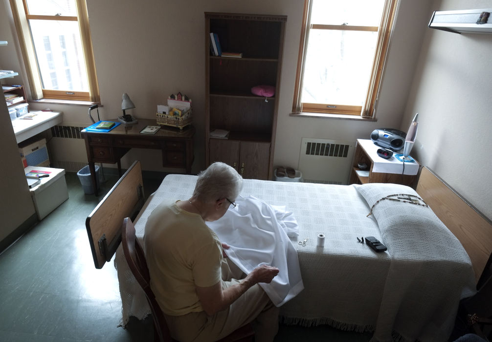 Third Place, Ohio Understanding Award - Andy Morrison / The (Toledo) BladeSr. Mary Mona sews a new alter cloth in her room.