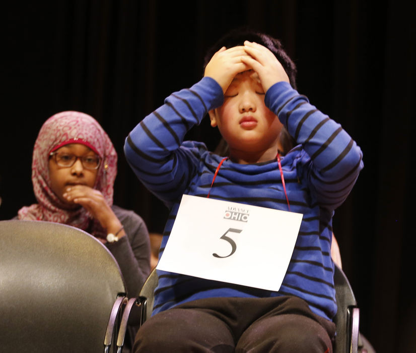 Award of Excellence, Photographer of the Year - Large Market - Gus Chan / The Plain DealerDavid Kuang, of Beachwood Middle School, holds his head in between rounds of the Cuyahoga County spelling bee.  