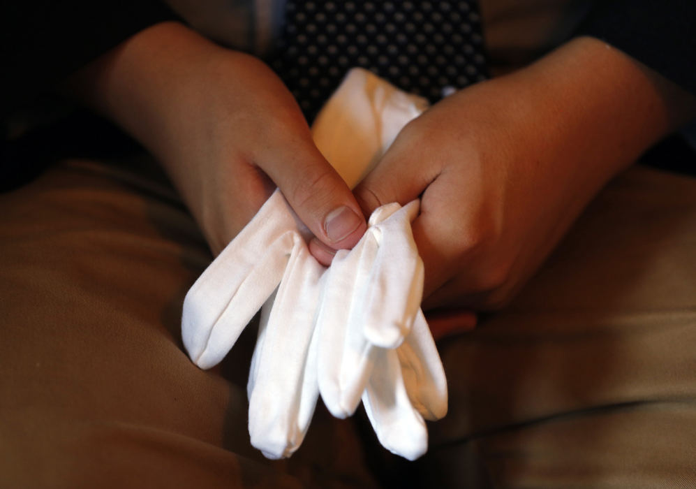 Award of Excellence, Photographer of the Year - Large Market - Gus Chan / The Plain DealerWhite gloves are handed out to the Arimathea Pallbearers at the funeral of Can Chenat Zak Funeral Home.  July 25, 2015. 