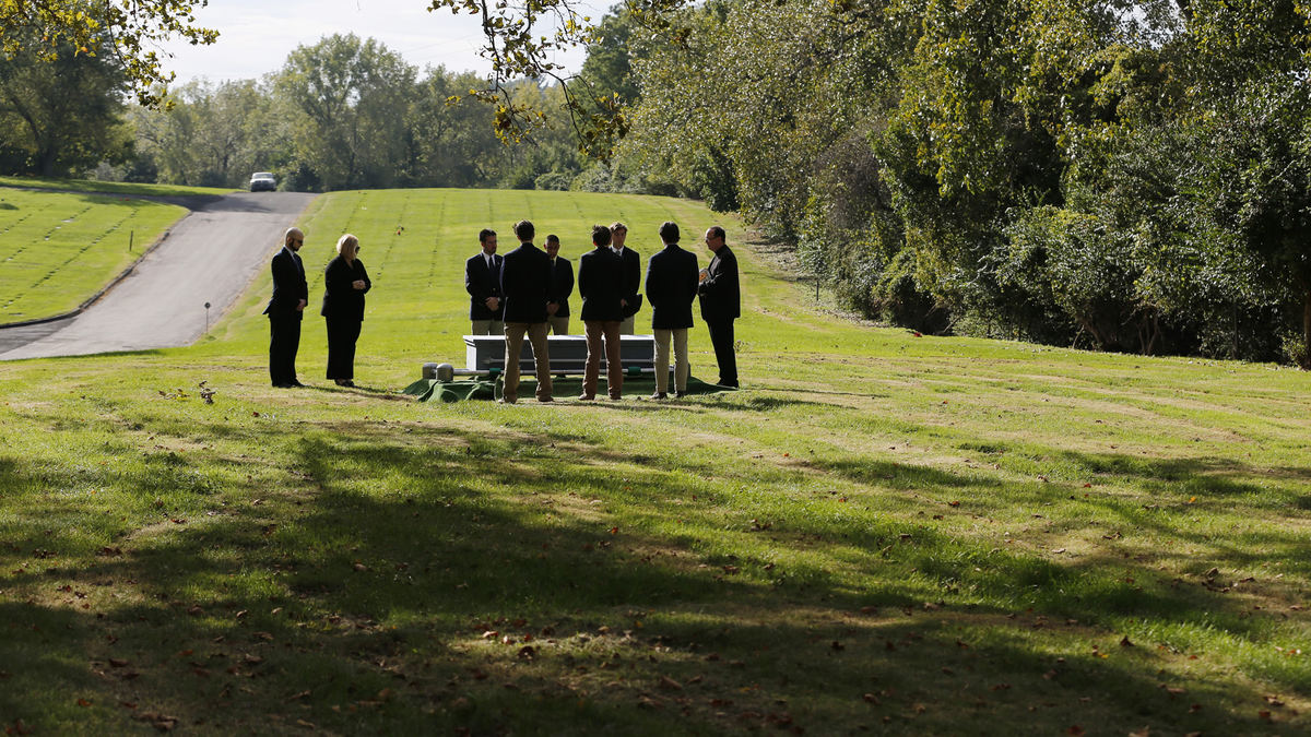 Award of Excellence, Photographer of the Year - Large Market - Gus Chan / The Plain DealerAttendees from Bican Bros. Funeral Home, Fr. Joseph Callahan and six members of the St. Joseph of Arimathea Pallbearers Society pay their last respects to Michael Zamborsky, an indigent man, at Calvary Cemetary. 
