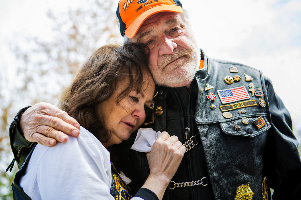 First Place, Photographer of the Year - Large Market -  / The Enquirer/Meg VogelTom Krekler comforts Rita Lewis at Old St. Joseph's Cemetery, where Rita's late husband, Butch Lewis,  is entombed Saturday, April 2, 2016. Krekler and a dozen Teamsters led a memorial motorcycle ride to the cemetery to honor the life of the former Local 100 president, Butch Lewis. He passed away from a stroke on December 31, 2015. Before his death, Butch was leading an effort to fight deep pension cuts for the Teamsters. His wife, Rita, continued to fight against the pension cuts after his death and became a national spokesperson for the Teamsters. 