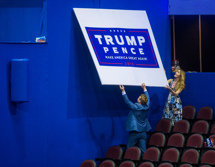 First Place, Photographer of the Year - Large Market -  / The Enquirer/Meg VogelAt the conclusion of the Republican National Convention, attendees attempt to take an official "Trump Pence" sign from Quicken Loans Arena in Cleveland, Ohio Thursday, July 21, 2016. 