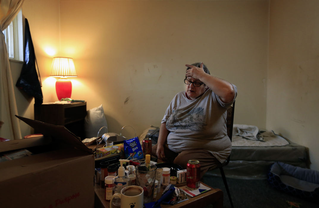Second PlaceSecond Place, Photographer of the Year - Large Market - Kyle Robertson / The Columbus Dispatch Corrie Read takes a moment after packing up her belongings after being told today that the apartment building she has been living in for the past 13 years was closing on 2958 Sullivant Avenue in Columbus on March 3, 2016.  The apartment was shut down for unlivable conditions and crime by the City attorneys.  Read had to be out of the building by tonight. 
