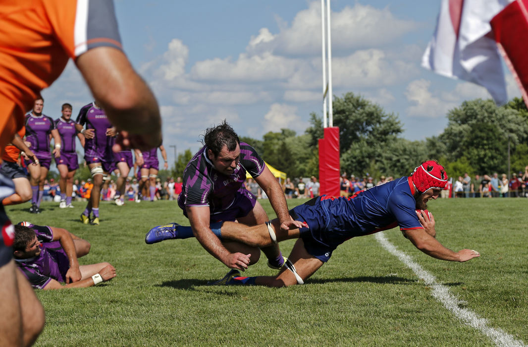 Second Place, Photographer of the Year - Large Market - Kyle Robertson / The Columbus Dispatch Ohio Aviators Riekert Hattingh (8) scores the game winning try against Denver Stampede Chris Baumann (3) to win the game during the final regular season game during the inaugural season of the Professional Rugby Organization in Columbus, Ohio on July 31, 2016.  Denver won the overall Championship by one bonus point.
