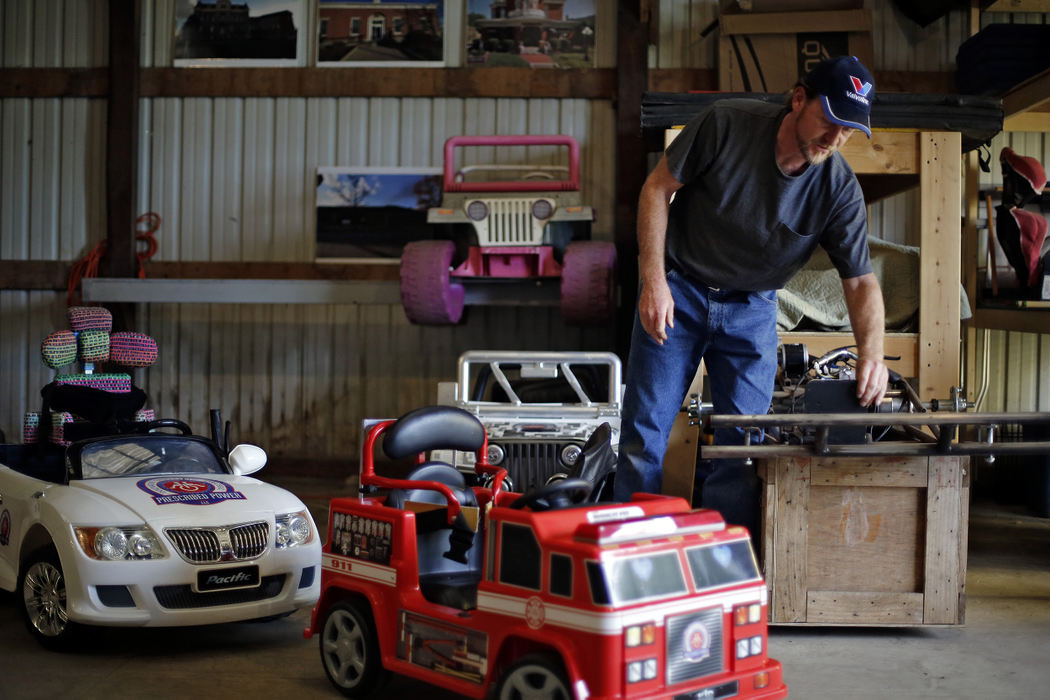 Second Place, Photographer of the Year - Large Market - Kyle Robertson / The Columbus Dispatch Rocky Grimes starts to work on go-cart between sessions on a farm in Mechanicsburg, Ohio on October 3, 2016.  "Kids with disabilities are always standing on the sidelines, watching traditionally-developed kids have all the fun. That's so wrong," Rocky said. "So you take a kid — he can't get out of bed, he can't climb a tree, maybe he can't even ever go to a movie. But let me strap him in a go-cart and run him through a meadow, an hour of freedom with the wind on his face, and that changes him. I have physics on my side. Engage the mind and the body will follow." Rocky runs Prescribed Power that develops equipment, programs, environments and strategies that make interactions between individuals of varying abilities and economic status mutually beneficial.  