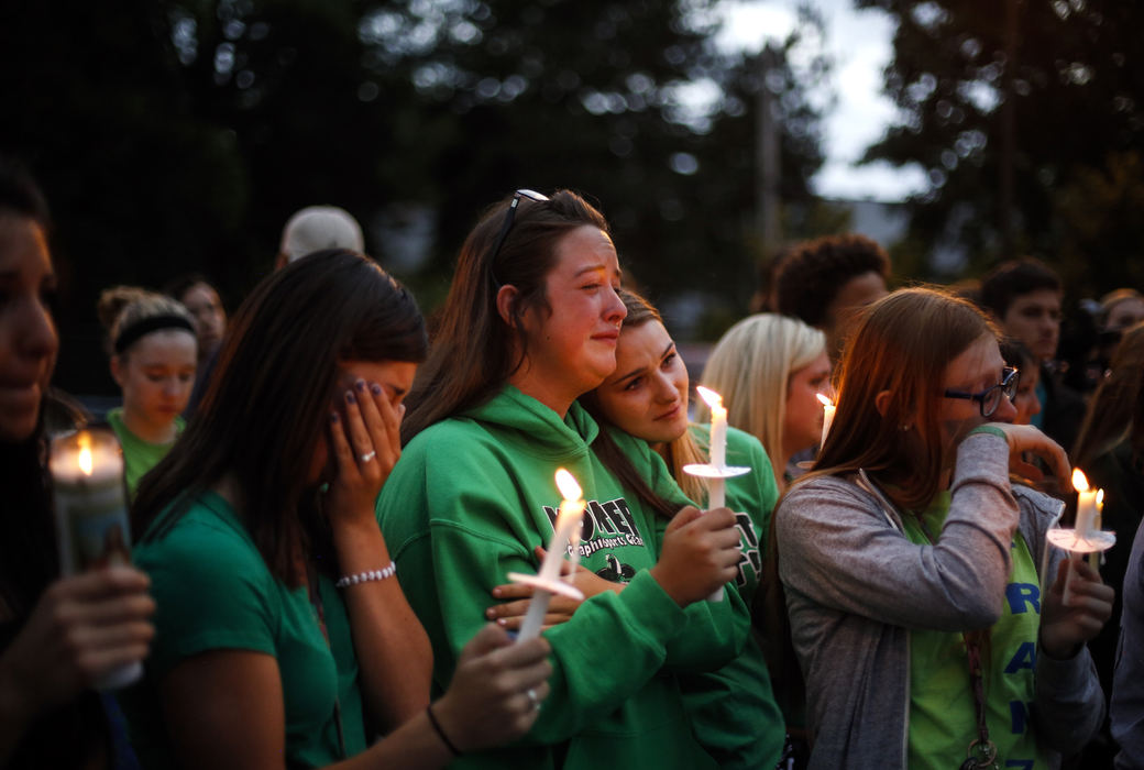 Third Place, Photographer of the Year - Large Market - Andy Morrison / The (Toledo) BladeWhitmer High School students mourn during a vigil at the school, for classmate Joshua Sorrell, who died after falling down an elevator shaft inside a vacant building.