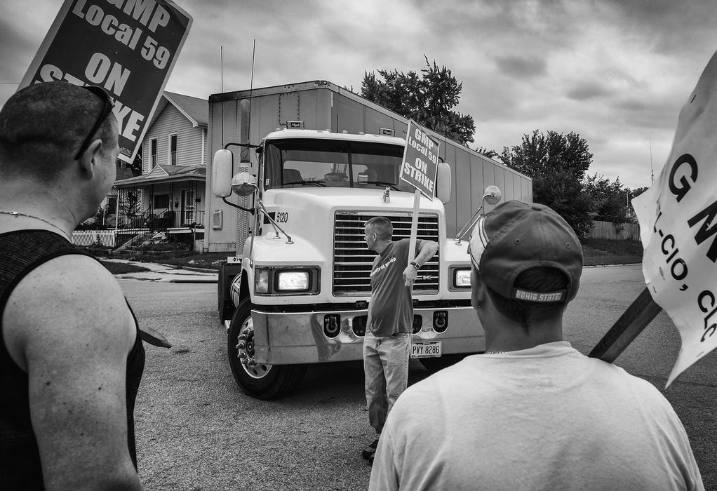 Third Place, Photographer of the Year - Large Market - Andy Morrison / The (Toledo) BladeUnion workers block a truck driver as he tries to turn into Libbey Glass during a strike at plant in Toledo.