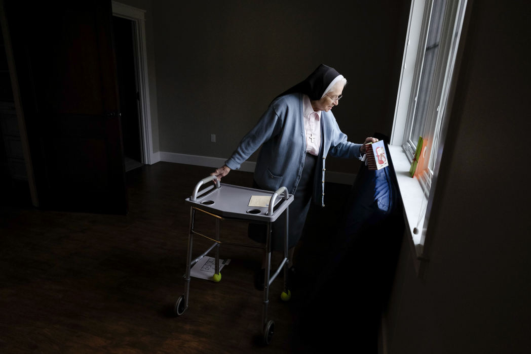Third Place, Photographer of the Year - Large Market - Andy Morrison / The (Toledo) BladeSr. Rose Maria Moser looks at a present left in her new room by students from Lial Catholic School, after moving into the new Sisters of Notre Dame Center in Whitehouse.