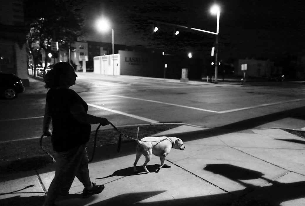 Third Place, Photographer of the Year - Large Market - Andy Morrison / The (Toledo) BladeDiann Wears and her dog Cow walk the streets near the old Greyhound Terminal at Jefferson Avenue and Michigan Street.