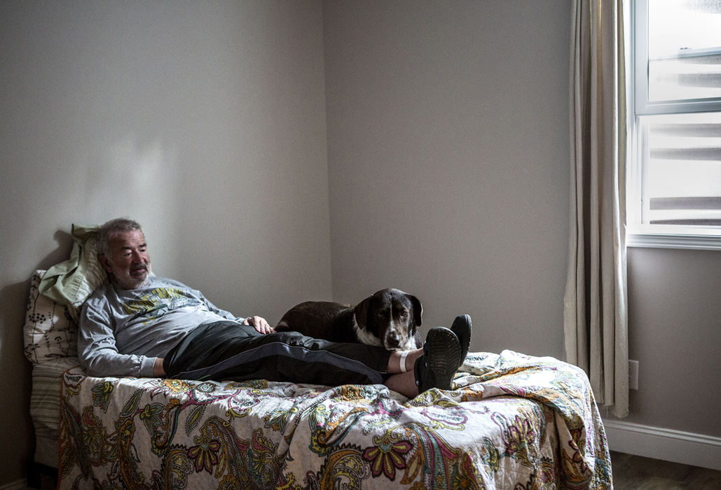 First Place, Photographer of the Year - Small Market - Jessica Phelps / Newark AdvocateEvery night when Tom goes to bed Charlie, the family dog, climbs into the small single bed with him. 
