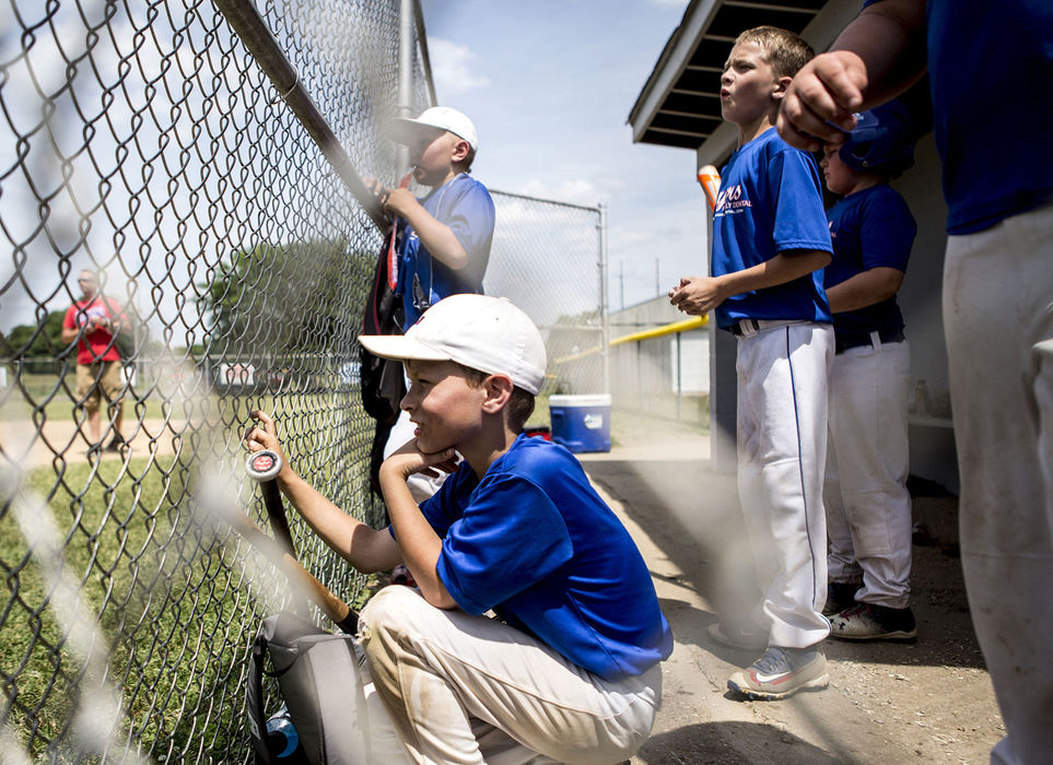First Place, Photographer of the Year - Small Market - Jessica Phelps / Newark AdvocateMeyers Dental players watch their quarterfinal game against Pappy's Grill. Teams throughout Licking County gathered at Mound City baseball fields Saturday to play in the Shrine Tournament quarter finals. 
