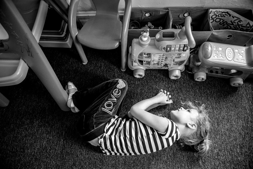 First Place, Photographer of the Year - Small Market - Jessica Phelps / Newark AdvocatePhoenix's "happy place" is on the floor of her bedroom, playing with her toys that light up and make noise. Phoenix, 8, was diagnosed with autism spectrum disorder and is mostly nonverbal. 