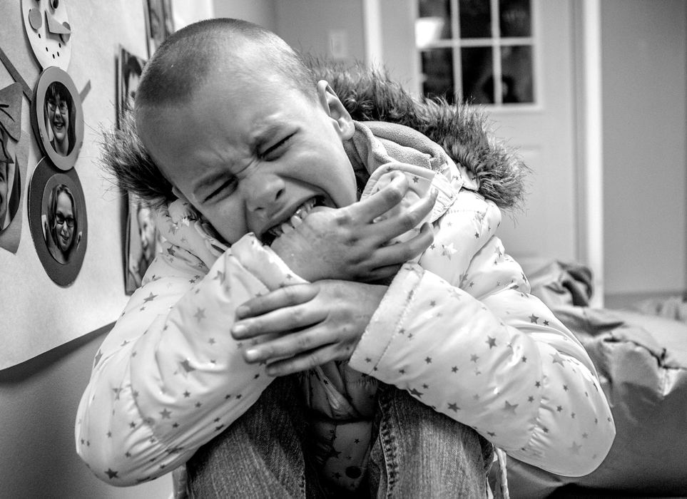 First Place, Photographer of the Year - Small Market - Jessica Phelps / Newark AdvocateAfter her first occupational therapy visit, Phoenix  has a break down in the hall because the zipper on her coat would not zip correctly. A common coping mechanism for Phoenix when things become to much for her is biting and scratching, usually herself. It breaks her mom, Savannah's heart every time she witnesses this, but she has learned when to interfere and when to let Phoenix wrestle with her emotions. 