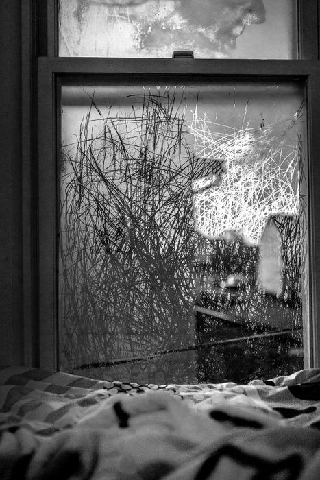 First Place, Photographer of the Year - Small Market - Jessica Phelps / Newark AdvocateAs the cold air moved in and created frost on the windows Savannah began hearing a scratching noise at night. It turns out it was her daughter, Phoenix, etching out lines on the frosted windows before falling asleep. 