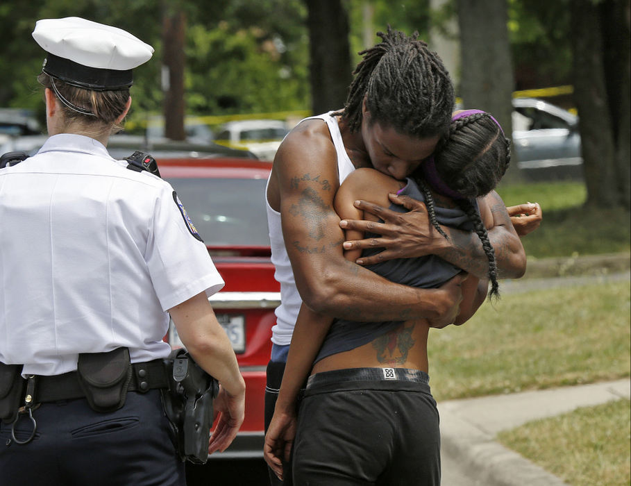 Second Place, Spot News - Barbara J. Perenic / The Columbus DispatchA man comforts a distraught woman at the scene of a fatal shooting in the 4100 block of Larry Place.