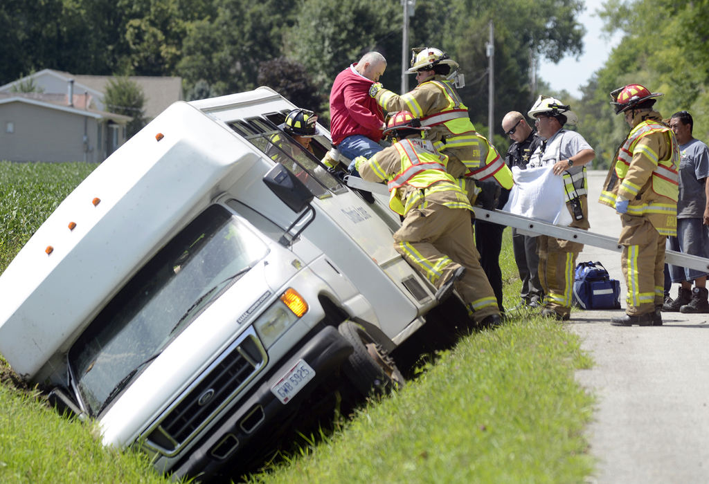 Award of Excellence, Spot News - Erin McLaughlin / Sandusky RegisterMargaretta Township firefighters help an occupant out of a nursing home van after it crashed into a ditch on Homegardner Road, near the intersection of Maple Avenue. No injuries were reported.