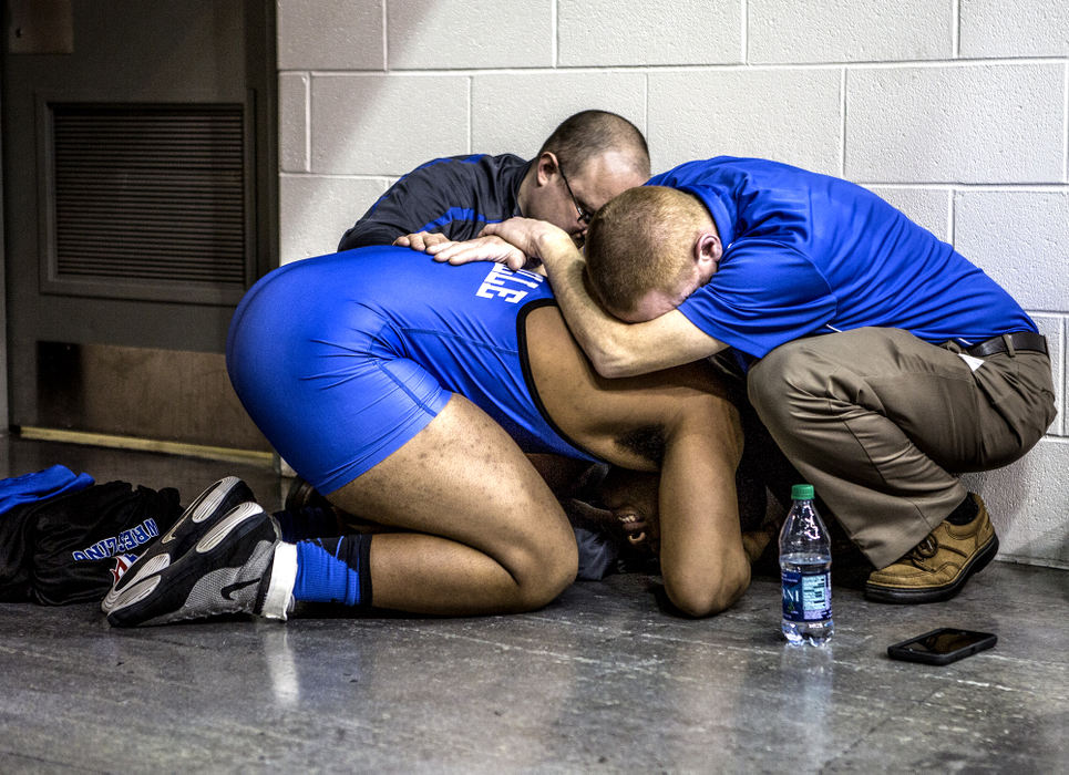 First Place, Ron Kuntz Sports Photographer of the Year - Jessica Phelps / Newark AdvocateLeo Crosby, a senior at Zanesville High School, is embraced by his coaches, Chris Miller andPat Lawson after failing to qualify for the final match at the 2016 state wrestling finals. Crosby was the wrestler from his school to qualify for the state meet in over 40 years. This year was his second and final chance to make the podium, but he fell just short of making the cut. 