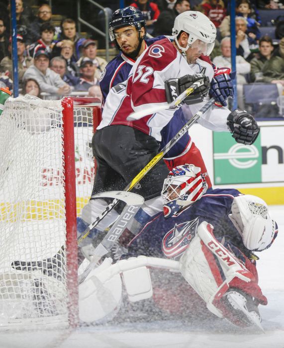 Second Place, Ron Kuntz Sports Photographer of the Year - Joshua A. Bickel / ThisWeek Community NewsColorado Avalanche defenseman Francois Beauchemin (32) collides with Columbus Blue Jackets goalie Curtis McElhinney (30) while attempting to score during the second period of a NHL game between the Columbus Blue Jackets and the Colorado Avalanche on Monday, November 21, 2016 at Nationwide Arena in Columbus, Ohio. No interference was called on the play.