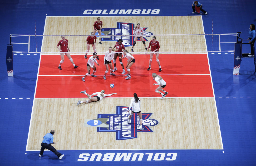 Second Place, Ron Kuntz Sports Photographer of the Year - Joshua A. Bickel / ThisWeek Community NewsMinnesota Golden Gophers middle blocker Paige Tapp (4) misses a dig during the first set of a NCAA Division I women's volleyball national semifinal between the Minnesota Golden Gophers and the Stanford Cardinal on Thursday, December 15, 2016 at Nationwide Arena in Columbus, Ohio.