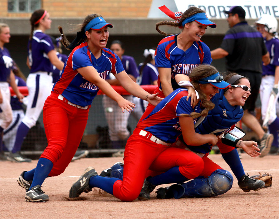 First Place, Ron Kuntz Sports Photographer of the Year - Jessica Phelps / Newark AdvocateThe Lakewood  girls softball team rush into a pile up on the field after beating Keystone 7-4 in the D-II softball state championship game.