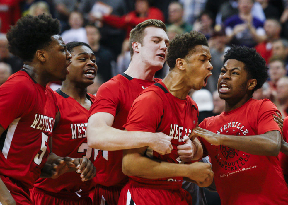 Second Place, Ron Kuntz Sports Photographer of the Year - Joshua A. Bickel / ThisWeek Community NewsWesterville South guard Jordan Humphrey, center, celebrates after hitting the go-ahead jumper with 1.8 seconds left during the fourth quarter of the OHSAA Division I boys basketball state championship between the Westerville South Wildcats and the Lima Senior Spartans on Saturday, Mar. 19, 2016 at Value City Arena in Columbus, Ohio. Westerville South defeated Lima Senior 57-55. Humphrey led all scorers with 19 points.