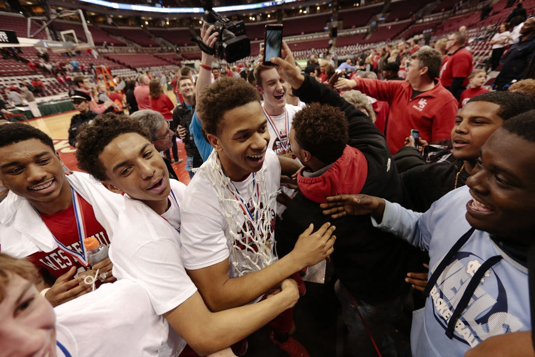 Second Place, Ron Kuntz Sports Photographer of the Year - Joshua A. Bickel / ThisWeek Community NewsWesterville South guard Jordan Humphrey (3) celebrates with fans after Westerville South's 57-55 victory against Lima Senior during their OHSAA Division I boys basketball state championship on Saturday, Mar. 19, 2016 at Value City Arena in Columbus, Ohio. Humphrey, who was named the tournament's Most Valuable Player, led all scorers with 19 points and hit the game-winning shot with 1.8 seconds left. 