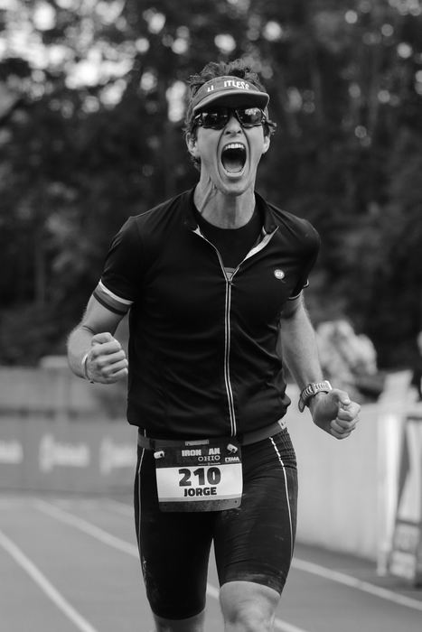 Second Place, Ron Kuntz Sports Photographer of the Year - Joshua A. Bickel / ThisWeek Community NewsJorge Urruta, of New York City, celebrates as he nears the finish line during the Ironman 70.3 Ohio triathlon on Sunday, August 21, 2016 at Selby Stadium in Delaware, Ohio. Urruta finished a 1.2-mile swim, a 56-mile bike ride and a 13.1-mile run in 4 hours, 59 minutes and 56 seconds. 