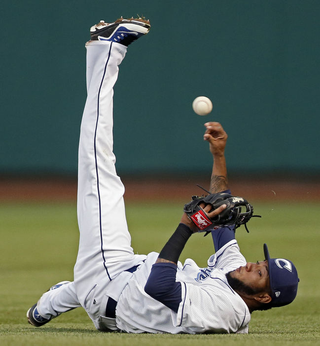 Third Place, Ron Kuntz Sports Photographer of the Year - Kyle Robertson / The Columbus DispatchAfter making a diving catch on a ground ball Columbus Clippers second baseman Ronny Rodriguez (13) throws out Charlotte Knights center fielder Jacob May (3) runner at 1st base during their game at Huntington Park in Columbus, Ohio on April 26, 2016. 
