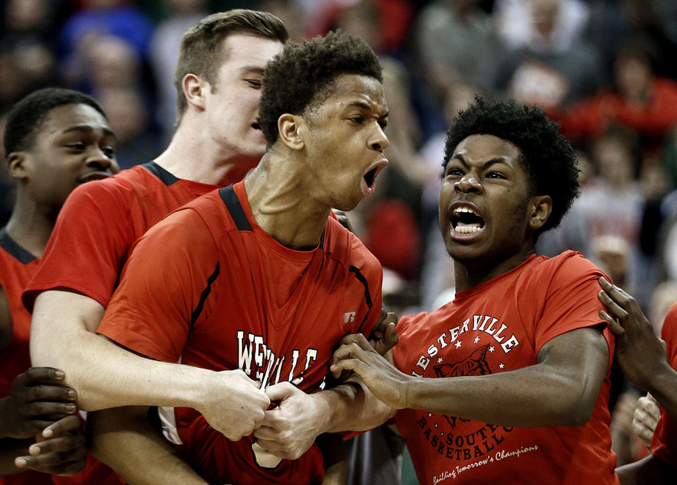 Third Place, Ron Kuntz Sports Photographer of the Year - Kyle Robertson / The Columbus DispatchWesterville South Jordan Humphrey (3) celebrates after making the game winning shot against Lima Senior in the 2nd half in the Ohio High School Division I championship game at Value City Arena in Columbus, Ohio on March 19, 2016. 