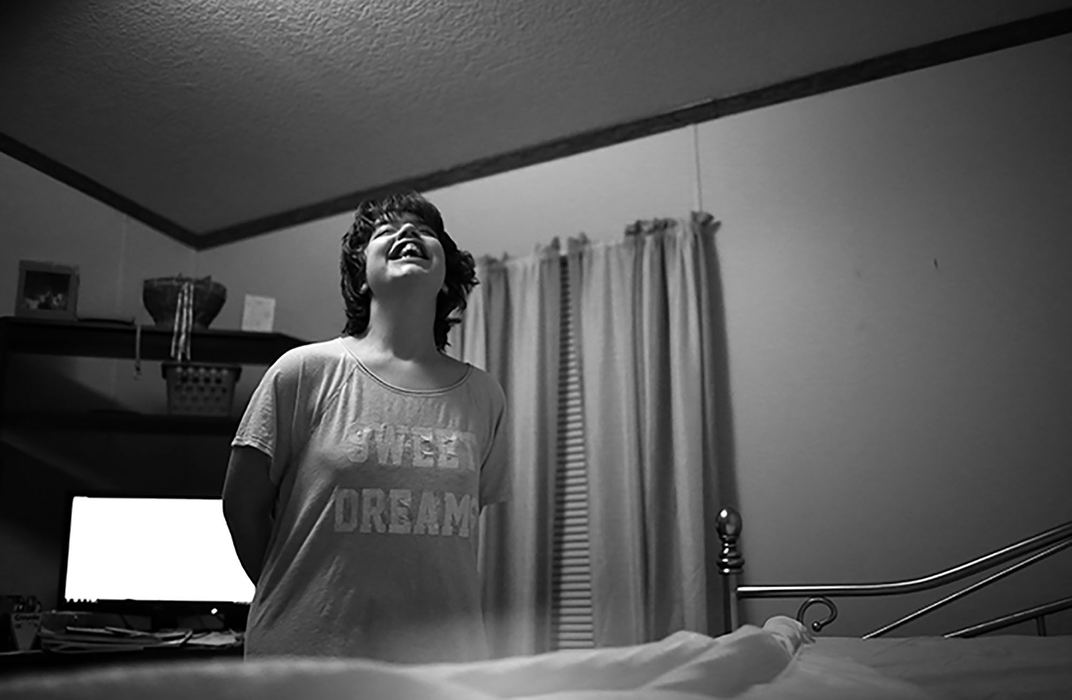 First Place, Chuck Scott Student Photographer of the Year - Andrea Noall / Kent State UniversityHaley Smith is an 18-year-old girl who has severe, non verbal autism, which causes her to function at the level of a two-year-old. Each day, she struggles with completing everyday tasks and communicating with others. Her grandparents are her primary caregivers, who are working towards becoming her legal guardians. She attends special needs classes at her high school, where her teachers work hard to help Haley learn how to take care of herself. Even though taking care of Haley can be incredibly difficult, she has a great support system at home and at school. 